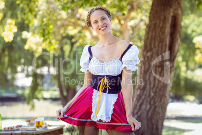 Pretty oktoberfest blonde smiling in the park