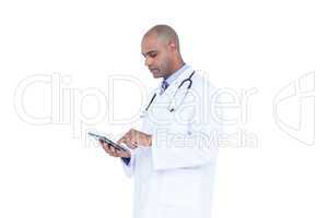 Serious doctor using tablet