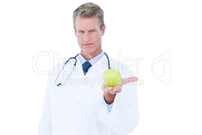 Doctor holding green apple