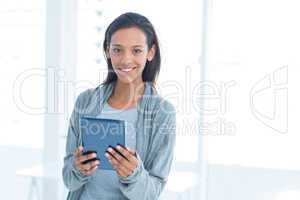 Businesswoman holding a tablet in the office