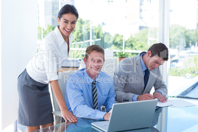 Business people using laptop