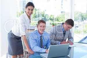 Business people using laptop