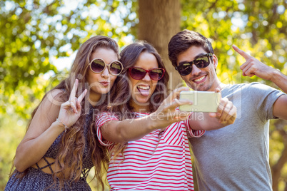 Happy friends taking a selfie