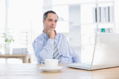 Thinking businessman on his office