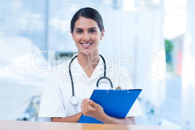 Beautiful smiling doctor looking at camera