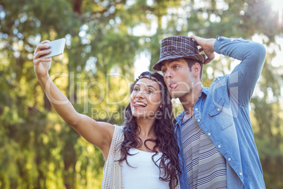 Hipster couple taking a selfie