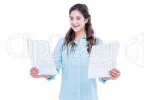 Pretty hipster holding sheets of paper