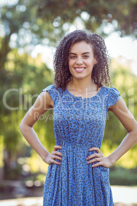 Pretty curly hair girl in a park