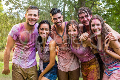 Happy friends covered in powder paint