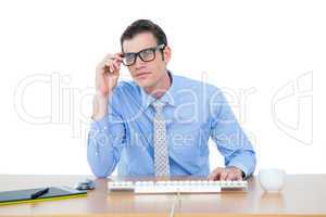 Businessman typing at his desk