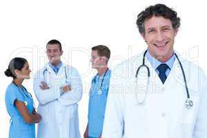 Doctors and nurses with arms crossed discussing