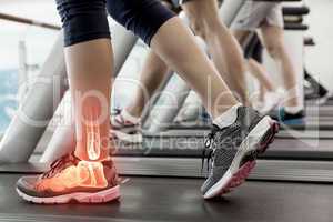 Highlighted ankle of woman on treadmill