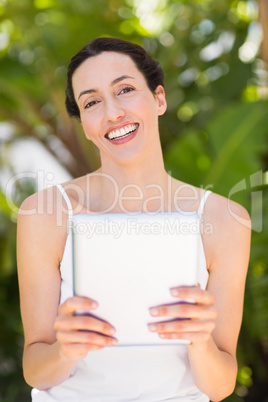 woman in white using her phone