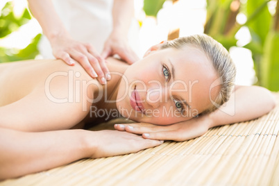 Attractive woman getting massage on her back