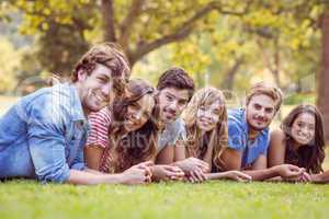 Friends lying and talking in the park