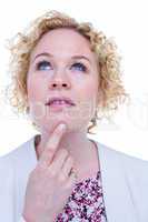 Thoughtful blonde woman looking up with finger on chin