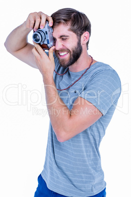 Happy handsome man taking pictures