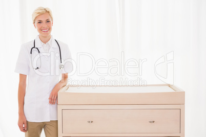 Portrait of a smiling blonde doctor with stethoscope