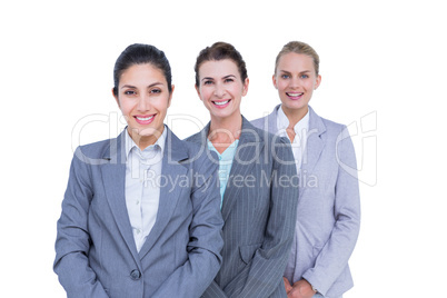 Smiling young businesswomen in a line