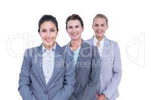 Smiling young businesswomen in a line