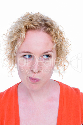 Blonde woman grimacing in front of camera