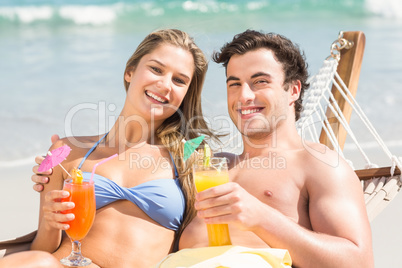 Happy couple napping together in the hammock