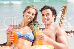 Happy couple napping together in the hammock