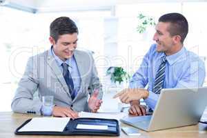 Businessmen working together with laptop