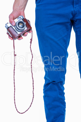 Close up view of man hand holding retro photo camera