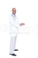 Confident doctor in white tunic writing notes