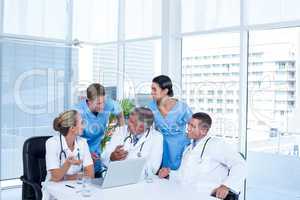 Team of doctors working on laptop