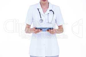 Standing doctor using tablet