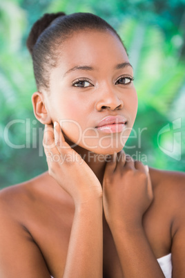 Close up of a beautiful young woman holding flower