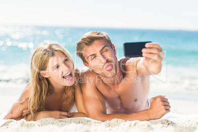 Happy couple taking selfie