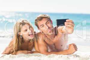 Happy couple taking selfie