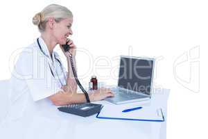 Smiling doctor having a phone call