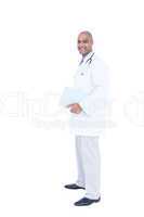 Standing doctor in white tunic writing notes