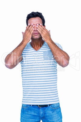 Man covering his eyes
