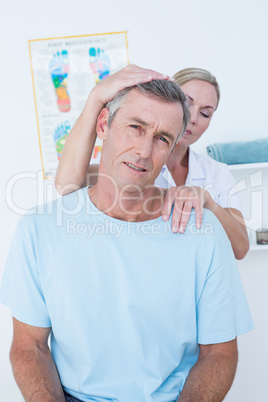 Doctor doing neck adjustment