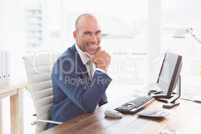 Smiling businessman looking at camera