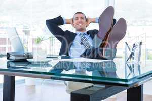 Businessman relaxing in his swivel chair
