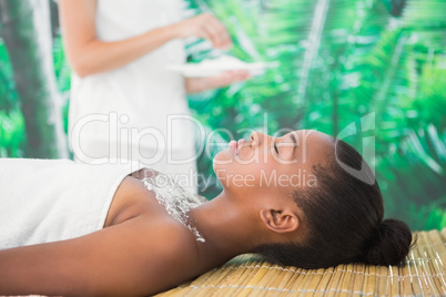 Pretty woman lying on massage table