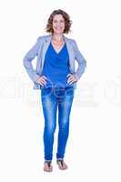 Businesswoman looking at camera with hands on hip