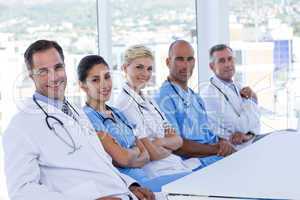 team of doctors looking at camera during meeting