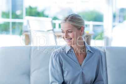 Businesswoman sitting on couch