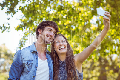 Hipster couple taking a selfie