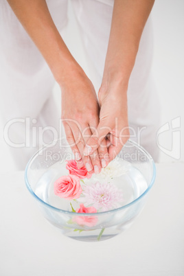 Woman making a hand treatment in a bowl