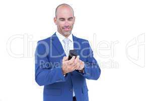 happy businessman playing with his smartphone