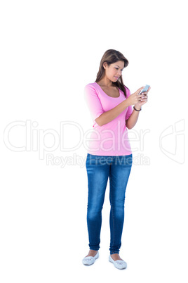 Pretty brunette using her smartphone