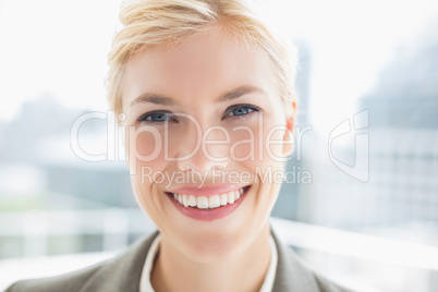 Smiling businesswoman looking at camera